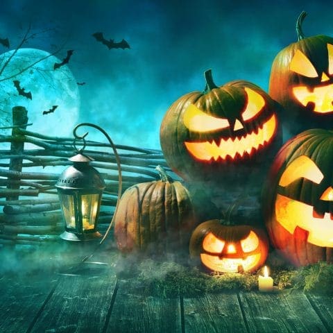 Halloween pumpkin head jack lantern with burning candles